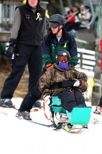 A solider at this past weekend's event takes to the slops in a specially modified ski rig. 