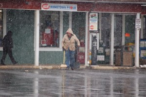 Moderate snow falls in Nellysford as folks hurry to get chores and errands done so they can head back inside. 