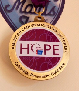 A medal that was presented to Cheryl after her completion of cancer treatments. 