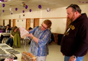 Photo By Tommy Stafford : ©2010 www.nelsoncountylife.com : Cancer survivor, Cheryl Tompkins looks over some of the items at Saturday's event. Click photos to enlarge. 