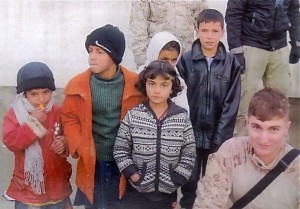  Lt. Matt Russo with school children in Afghanistan.