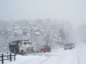 Photo By Heidi Crandall : ©2010 www.nelsoncountylife.com : A driver works with his snow plow to clear the intersection at Route 151 & 664 headed up to Wintergreen. 