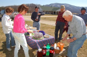 Some of the folks on hand Tuesday enjoyed a picnic style lunch outside in the fantastic weather. The Verandah is seen off in the background. 