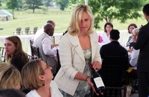 Emily Hodson Pelton, winemaker at Veritas Vineyard and Winery offers some of her wine to guests during a tour and tasting at the winery.