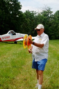 Graham gets ready to secure the tow line to Ben's glider just before takeoff. 