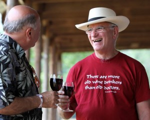 Gus Harika, left, jokes with his friend Bob Petres, both of Richmond, Va. at the Summer Solstice Festival.