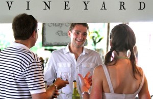 Nicholas Pope of Flying Fox Vineyard talks about their wines with festival goers at the Summer Solstice Festival.