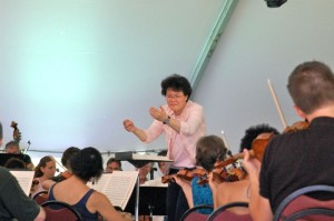 Photo By John Taylor : Guest conductor Mei-Ann Chen, internationally renowned conductor, leads the Wintergreen Festival Orchestra during a rehearsal session this past weekend at Wintergreen. 