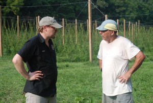 Head Brewmaster, Jason Oliver (left) from Devils Backbone Brewing talks with David Bernard at his Madhops Farm. Jason purchased some of the hops for use in his wet hop brew called Blue Ridge Hop Revival. It will be ready in about a month.  
