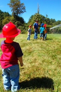 Photos By Tommy Stafford : ©2010 www.nelsoncountylife.com : A youngster looks on and waits his turn at the fire hose during the Montebello Community Market Day this past Sunday - Sept 5, 2010. Click any photo to enlarge. 