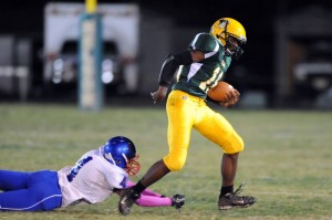 Tyler Vest, a NCHS sophomore, (18) eludes a tackle from Shaq Pannell , a junior at Dan River (4)