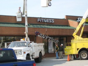 Photo Courtesty of Anytime Fitness Lovingston : Crews install signs for Lovingston's newest fitness center scheduled to open in a few weeks. Click to enlarge. 