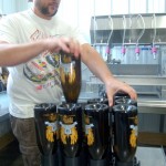 Brian Goff filling bottles of beer. Photo by Tommy Stafford.