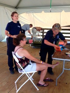Betsy Smith (R) working with Wintergreen Fire & Rescue tends to a patient during the festival at Arrington. Friday - September 6, 2013