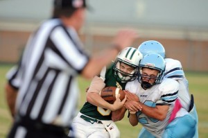 NCHS Payton Galloway (5) (QB/DB) tries to stay in bounds up against Page County Tyler Parker 