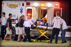 Injured Page County player is loaded in an ambulance and taken to hospital.