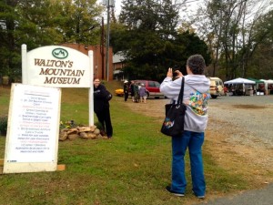 Fans pose for a camera shot in from of the museum's sign out front during the 21st anniversary celebration. 