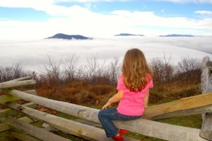 ©™2013 Blue Ridge Life : If you got up to the mountaintops during the day Saturday, it was basically full sunshine looking down on a cloud deck covering the valley below. Above BRL Juniorette Publisher Peyton Stafford takes a look from roughly 3700 feet above at the overlook on Devils Knob Loop at Wintergreen, VA**