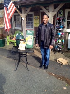 Clinton Hudson of Cinncinatti, Ohio standing beside the Big Green Egg he won in a raffle at Zestivities in the Wild Wolf Shopping Plaza in Nellysford, VA - Saturday - November 30, 2013. 