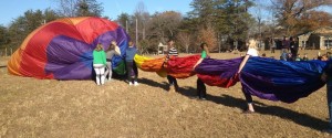 Photos Courtesy of NBS: North Branch students help Scott Cohrs, owner and chief pilot of Bonaire Charters, deflate a hot air balloon this past Monday - November 11, 2013 as part of a lesson in physics for students there. 