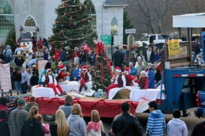 The Girl Scout float approaches the intersection of Front St and Main Street during the annual Lovingston Christmas Parade held Sunday - December 1, 2013.  