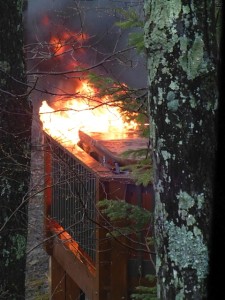 Photo Courtesy of Cathy Knowles: A large fire started in the hot tub area of a home on Ravens Roost Dr. at Wintergreen Friday afternoon April 24, 2014. Fire crews believe a lightning strike from a passing thunderstorm caused the fire. 