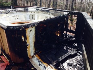 This is all that remained of the hot tub and the surrounding deck after after the lightning strike. According to Chief Sheets, "It looks like it struck the ground about 10 feet from the tub and then plowed a ditch to the deck." 