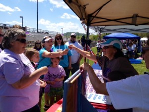 Lining-up for the distance challenge at Nelson Neighbors' booth at Relay for Life this past weekend at Nelson County High School. Challenge participants receive a bead for their necklaces for each lap they walk. Winner will receive a prize. 