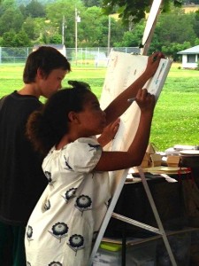 Olivia Trager (R) takes to the easel this past weekend at the annual RVCC membership drive. 
