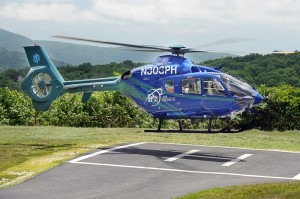 An AirCare5 medivac chopper lands Tuesday afternoon - July 1, 2014 at the Laurel Springs helipad at Wintergreen to meet fellow medic Bill Rice from Texas who is making a cross country trip from Oregon to Virginia in memory of three crew members who died in a Texas crash several years ago. 