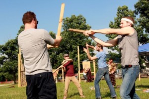 James Vesey of Danville, PA (left) and Hubbard Farr of New York City (right) practice stage combat with the instruction from Michael Kurowski of Chicago (middle).