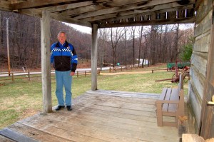 Mr. Mansfield in March of 2008 on the porch of the old Dodd Cabin he purchased and eventually restored. 