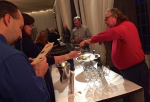 ©2014 Blue Ridge Life : Photos By Yvette Stafford : Jim Turpin (R) pwner of Democracy Vineyard & Winery in Lovingston  pours a taste of his wine for a representative from the International Circle of Wine Writers that were at Veritas Winery this past Thursday evening - November 6, 2014. 