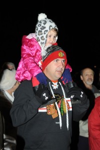 Steve McInich along with his daughter Chloe from Charlottesville, listen to the chorus sing Christmas carols.