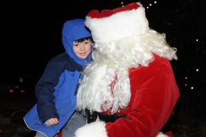 ©2014 Blue Ridge Life Magazine : Photos By BRLM Mountain Photographer Paul Purpura : This youngster was all smiles this past Wednesday night tell Santa all about the wish list during the annual tree lighting, caroling and Santa's visit at Stoney Creek in Nellysford. 