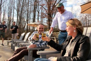 ©2014 Blue Ridge Life Magazine : Photo By BRLM Photographer Shay Munroe : Brian Shanks (center) co founder of Bold Rock Hard Cider Company in Nellysford, VA chats it up with a couple enjoying the mid 60's weather on Sunday afternoon - November 30, 2014. We'll see similar weather on Monday then winter makes a run at us again overnight. 