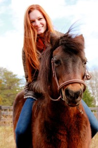 ©2014-2015 Blue Ridge Life Magazine : Photo By BRLM Photographer Shay Munroe : Lydia Holman of Nellysford has become quite the talk lately as she's been landing several high profile modeling gigs. Above she enjoys a little time back on the farm in Nelson County with her pony Carmen. When not back here she spends most of her days in school at the Savannah College of Art and Design or doing modeling jobs. 