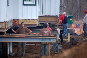 Crews put final touches on setting the historic Arrington Train Depot in place next to the signature Basecamp Restaurant - Wednesday afternoon - March 11, 2015. 
