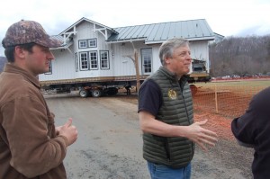 Steve Crandall (right) founder of Devils Backbone and his son Justin Crandall on the left in March 2015 when the old Arrington Depot was being moved from one side of the property to another.