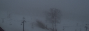 Screen capture via Wintergreen Resort's Web Cam : This shot around noon Wednesday shows the foggy and rainy conditions at Wintergreen Resort - Wednesday - February 24, 2016