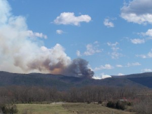 Photo By Carole Painter : A large mountain fire can be seen late Thursday afternoon between Lofton and Montebello heading down the Nelson County side. 