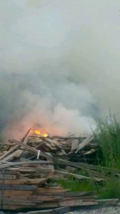 Photo courtesy of Lovingston Vol Fire Dept : Fire burns in a pile of old scrap lumber in an area south of Arrington on Friday evening - May 26, 2014