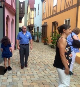 ©2016 Blue Ridge Life Magazine : Photo By Tommy Stafford : Will Fenton (L and owner of The Fenton Inn) strolls down the cobblestone street in the courtyard of his newly opened inn just off of the Blue Ridge Parkway. Wednesday - August 17, 2016