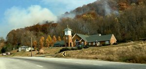 Photo By John Mckeithen : Fire continus burning on Peebles Mountain just behind St Mary's Catholic Church just north of Lovingston, Virginia Thursday morning November 24, 2016.  A fire line previously set at Buzzard's Rock by forestry crews was jumped overnight.