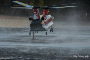Photo by Debbie Wilson - Lukay Photography - Piney River, Virginia : A chopper hovers over water in Amherst County to draw up water used in fighting the Mount Pleasant wildfire.