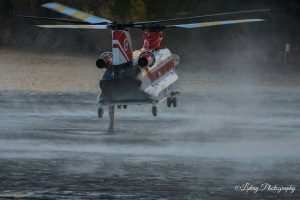 Photo by Debbie Wilson - Lukay Photography - Piney River, Virginia : A chopper hovers over water in Amherst County to draw up water used in fighting the Mount Pleasant wildfire. 