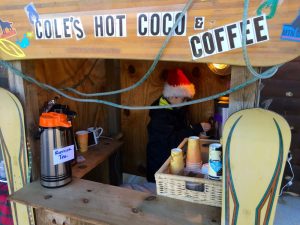 ©™2016 Blue Ridge Life Magazine / Nelson County Life Magazine : Photos By Digital Media Director Tommy Stafford : 10 year old Cole Chambers-Smithson draws up some yummy hot chocolate to serve from his coco stand in front of The Ski Barn at the foot of Wintergreen in Nelson County, Virginia. Saturday - December 10, 2016