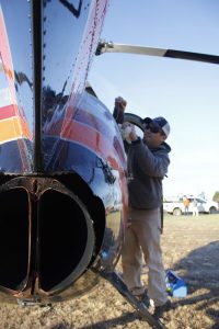 The Pilot for this project, Ryan Smith of Blacksburg, has been flying for ten years, and he’s spent the last five performing tasks such as these. Here he preps the helicopter for takeoff from CVEC Headquarters on Monday morning- March 20, 2017