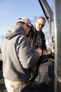 Ronnie Ponton with CVEC and Pilot Ryan Smith with Aerial Solutions do a radio communications check before he takes off Monday morning - March 20, 2017